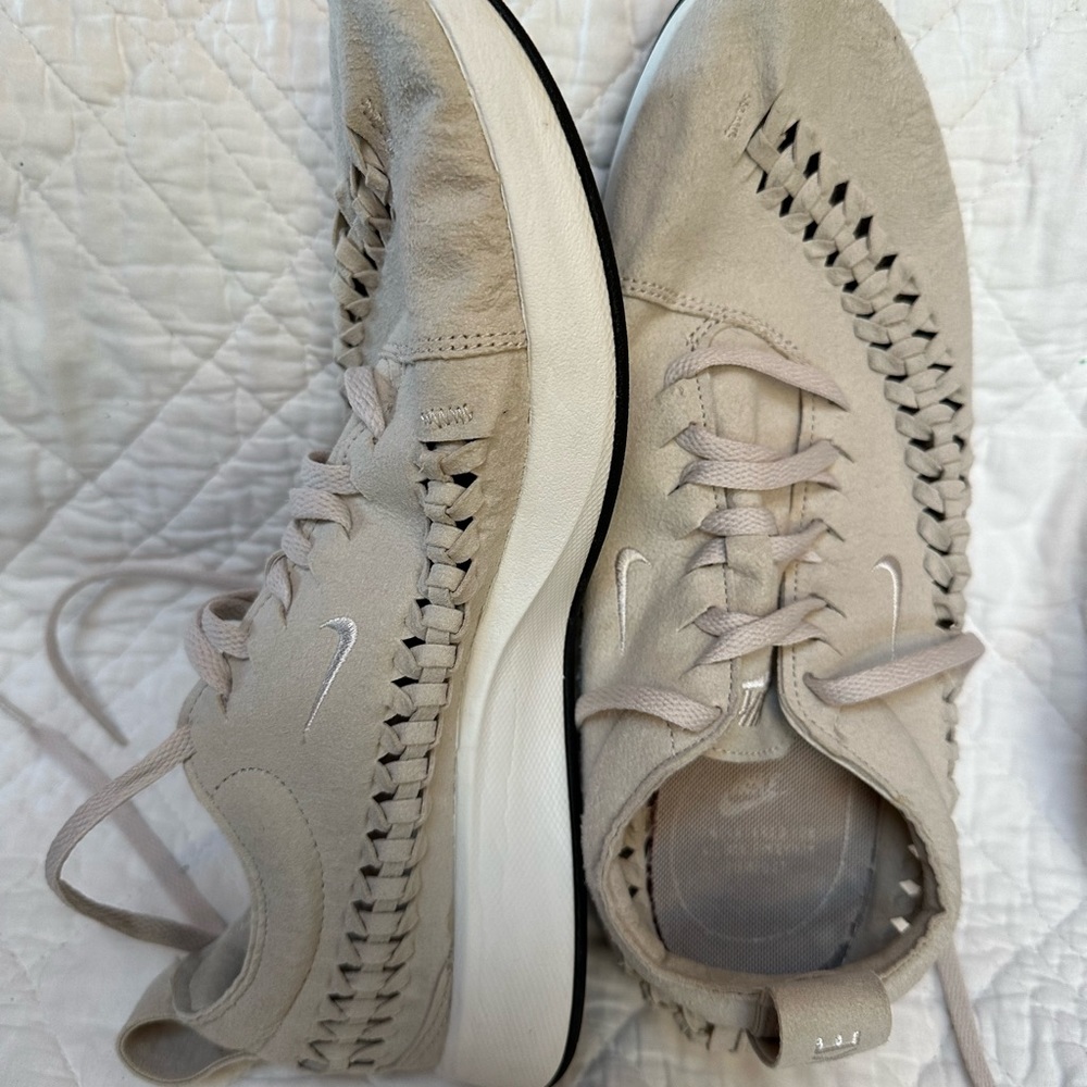 Tan, with braided accent. Suede material